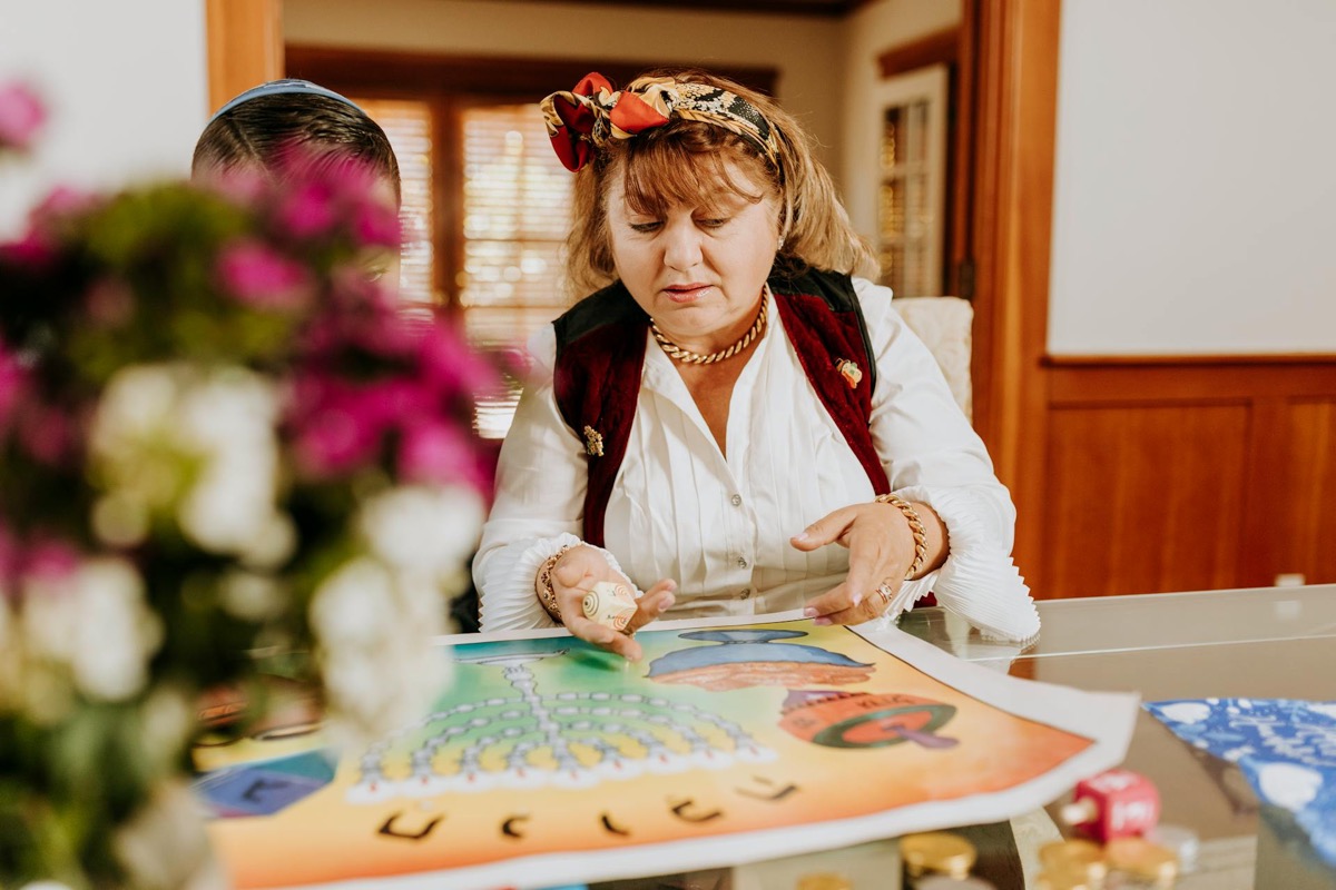 Collection of top-rated family board games arranged on table with diverse families playing