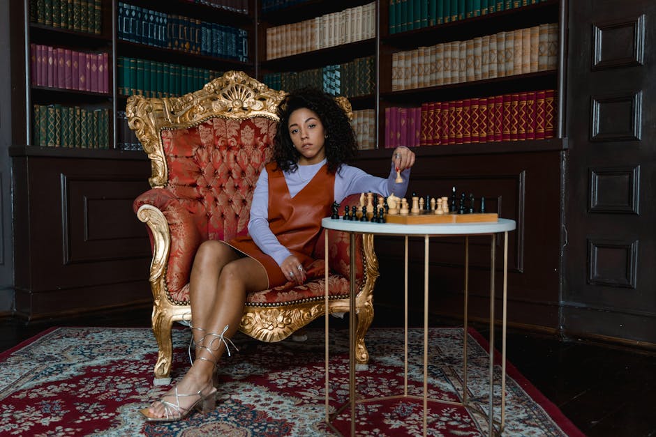 Players at a board game table with multiple different strategy paths represented on the game board